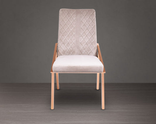Dining chair upholstered in fabric with rose gold plated stainless steel legs.