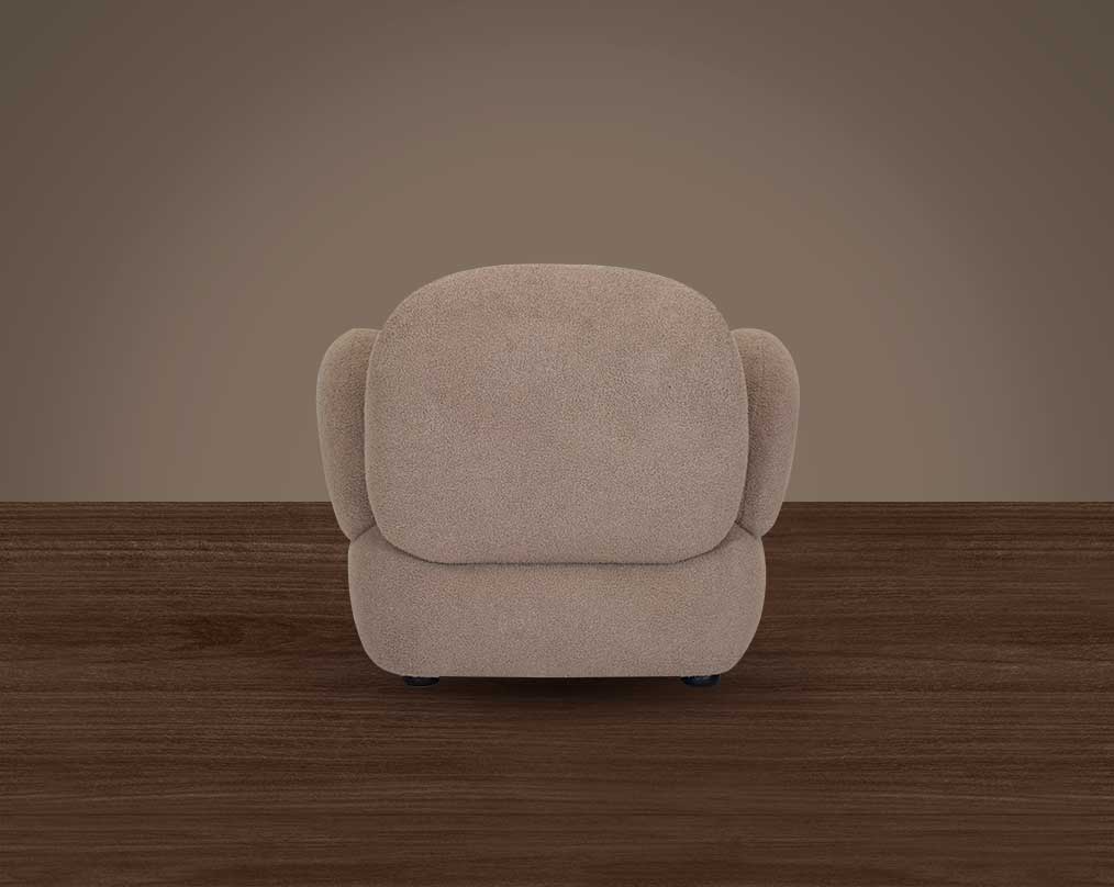 This sinuous & soft 1 seater sofa exudes a sense of calm & ease, upholstered in high-quality boucle fabric with wooden legs back view
