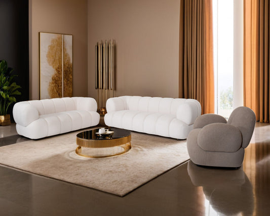 This sinuous & soft 3+2 seater sofa exudes a sense of calm & ease, upholstered in high-quality boucle fabric with wooden legs.