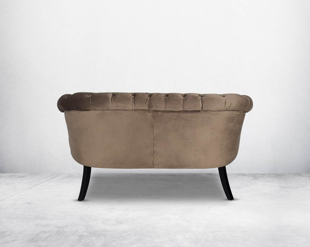 Two Seater Wing lounge chair back with upholstered in velvet fabric with tufted back and seat with steel rivets on the arms.