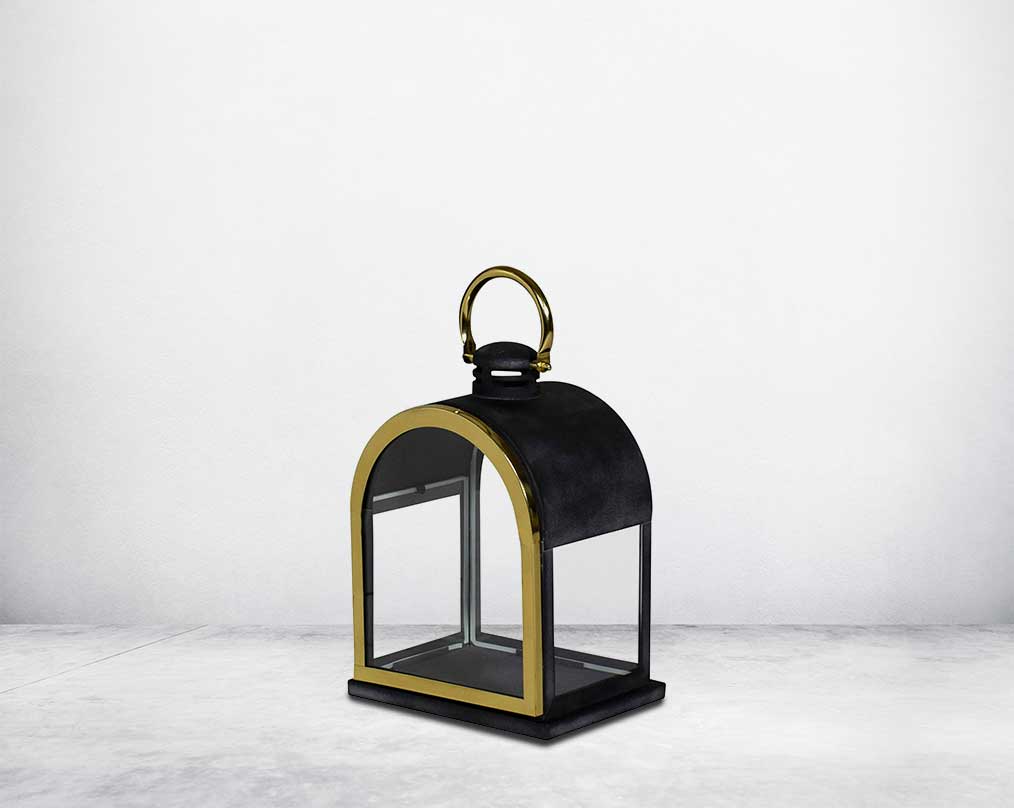 Lantern in clear glass and metal with gold plated stainless steel frame.