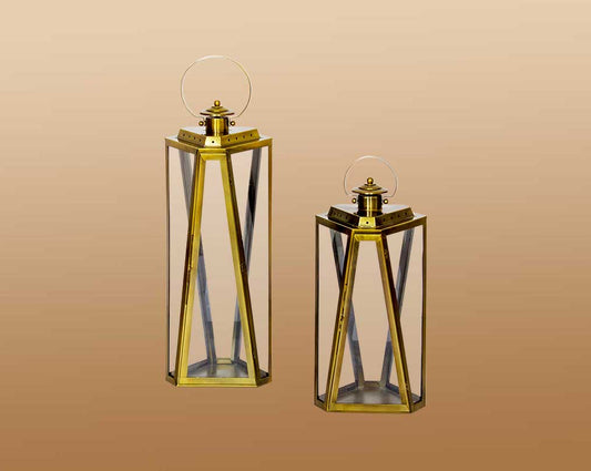 Lantern with clear glass and brass plated stainless steel.