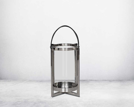 this lantern A master of reimagining classic forms, solid sheet metal frames feature broad panels of clear glass in a circular design small