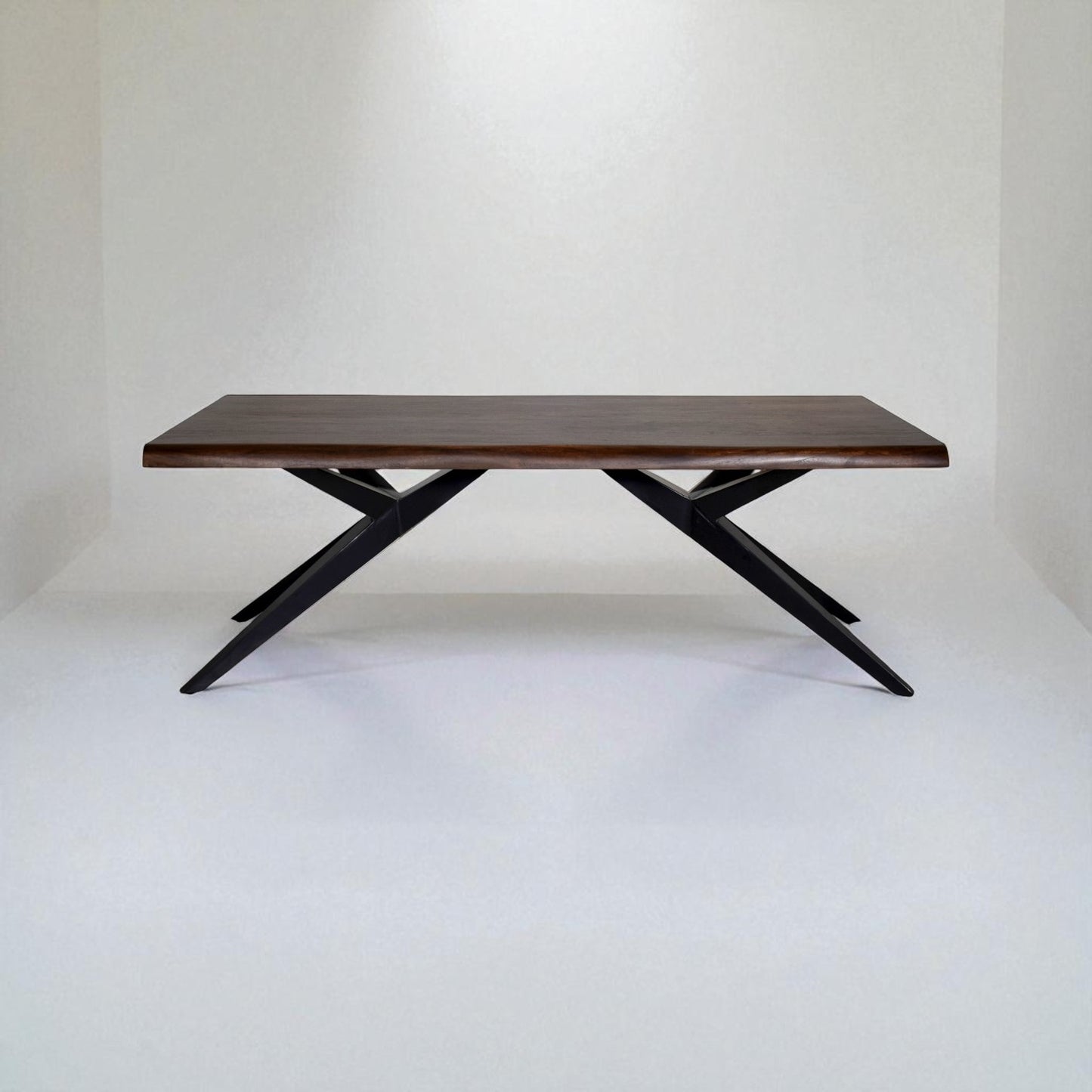 Wooden table with black metal legs on a white background