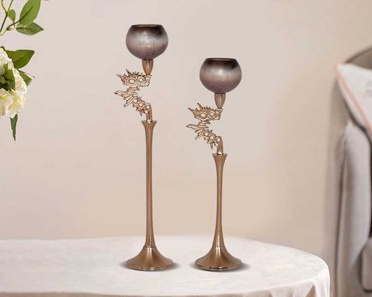 Goblet glass votive t-lite holder in champagne & earthy haven lustre glass with antique gold finish aluminium decorative base 1 large 2 small with table