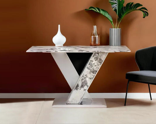 A stylish console with a natural white marble top and a glistening stainless steel crisscross base with living room