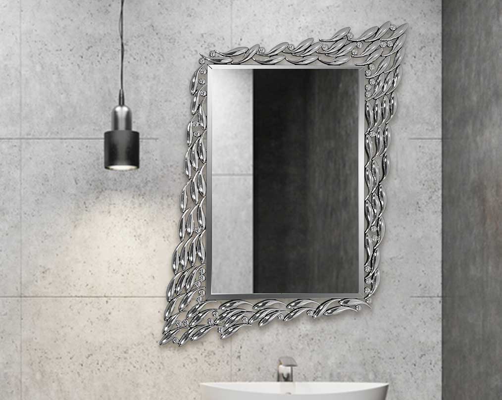 Rectangular wall mirror with silver mirror border in fish-shaped motif in ornamental design.
