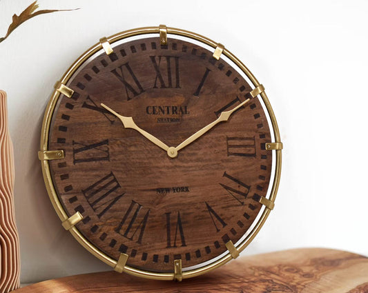 Wall clock in antique matt brass and natural wood finish in Roman numerals with table