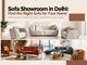 Sofa showroom in Delhi featuring white, orange, and blue sofa sets in stylish modern living room interiors, showcasing different designs for contemporary homes.