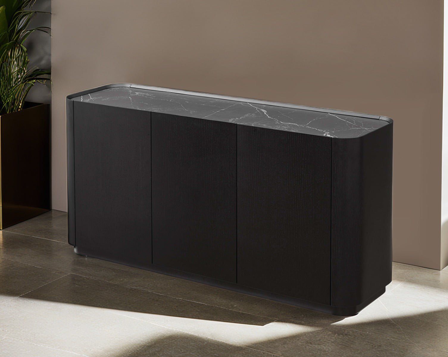 Black marble countertop against a beige wall