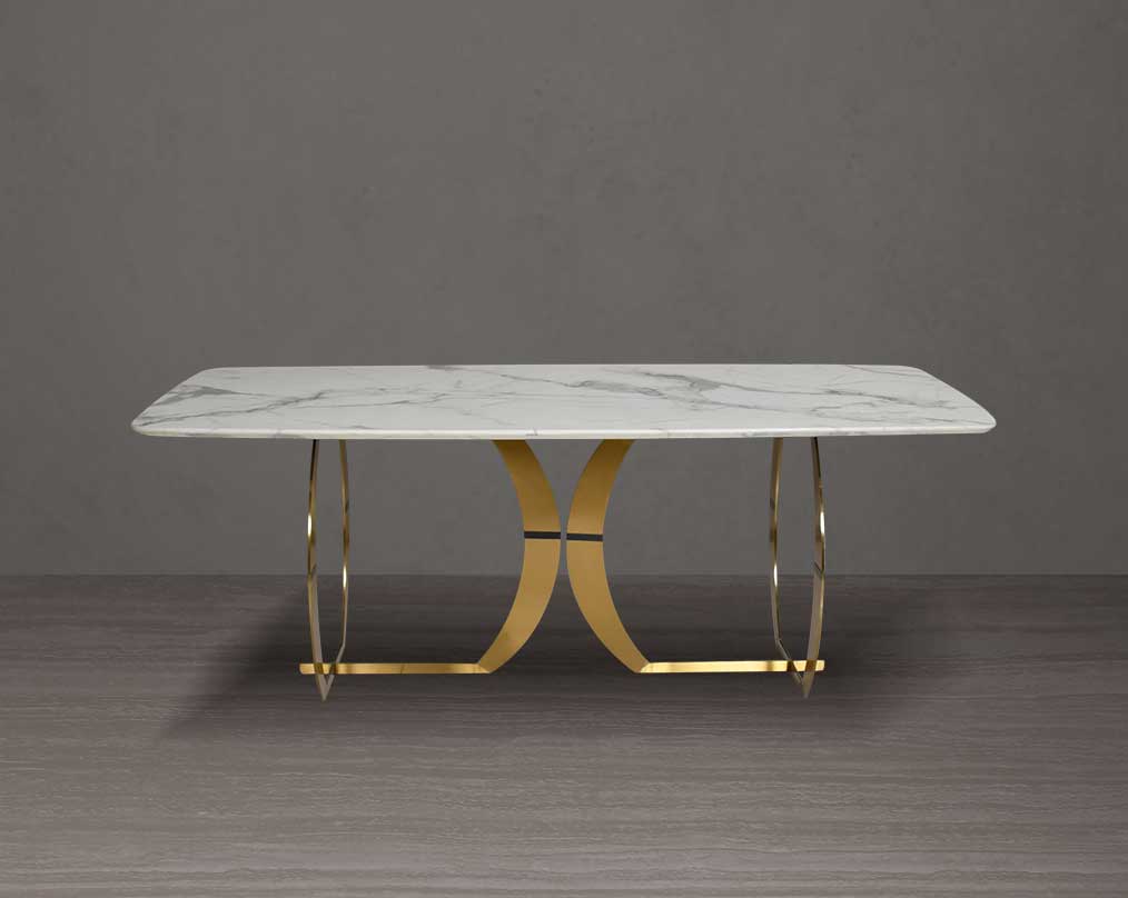 This beautiful & delicate 6 & 8 seater marble dining table is crafted to perfection. It is cast with a natural white a cursive artful base in matt gold plated stainless steel