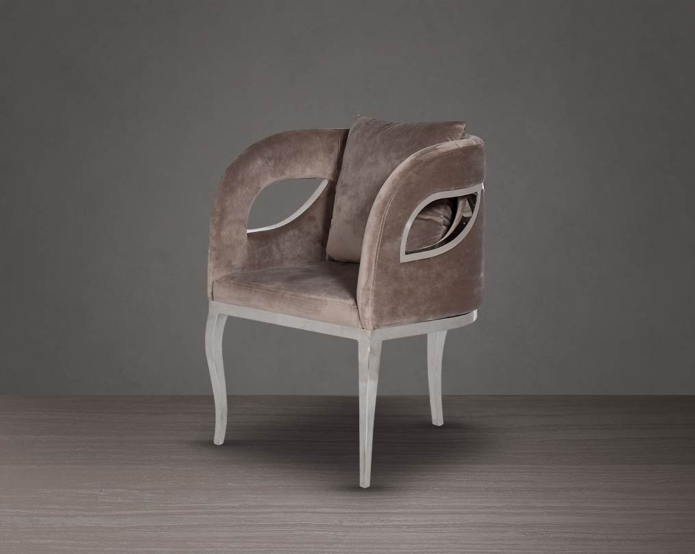 Leisure arm chair in fabric with stainless steel frame and legs.