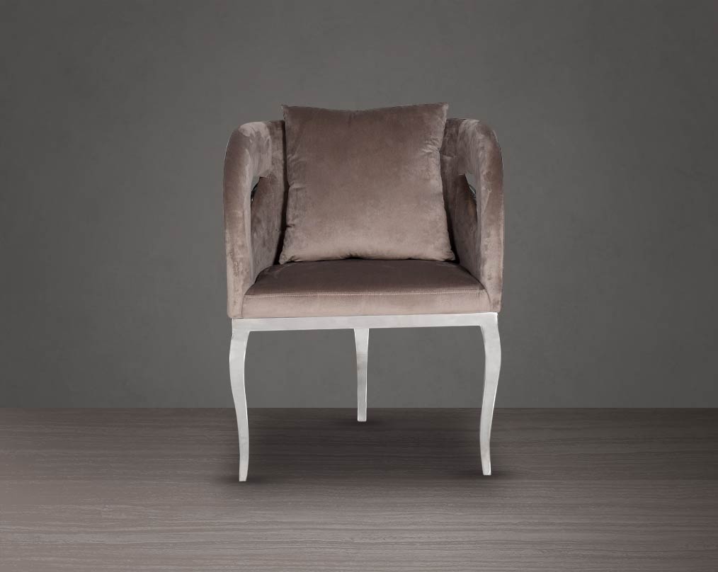 Leisure arm chair in fabric front with stainless steel frame and legs.