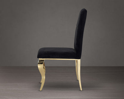 Dining chair upholstered in fabric side view  with gold plated stainless steel legs.