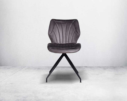This soft, cushioned dining chair front  features an extraordinary contemporary design with tufted back and cushioned seat with metal legs