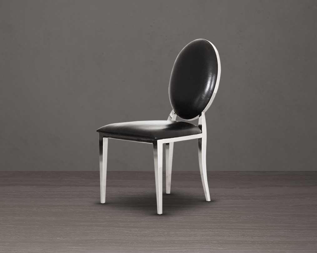 Dining chair upholstered in faux leather with stainless steel frame and legs.
