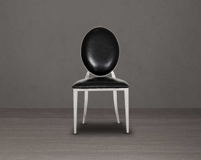 Dining chair upholstered in faux leather with front view stainless steel frame and legs.