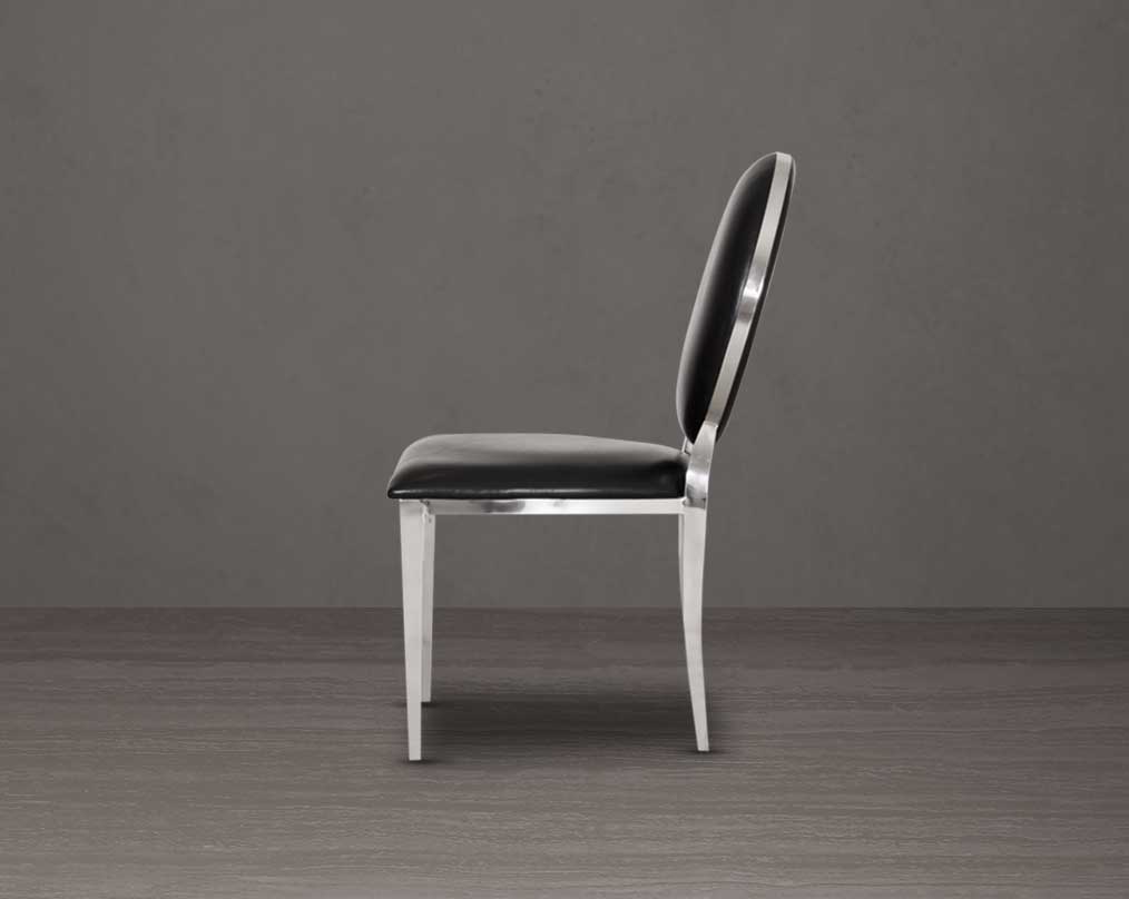 Dining chair upholstered in faux leather with side view stainless steel frame and legs.
