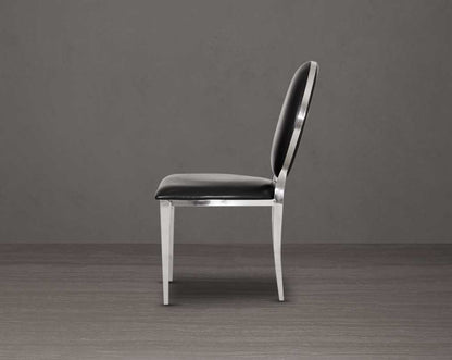 Dining chair upholstered in faux leather with side view stainless steel frame and legs.