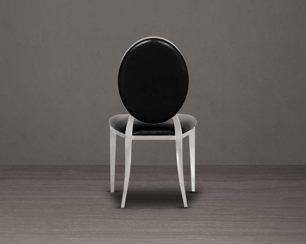 Dining chair upholstered in faux leather with back view stainless steel frame and legs.