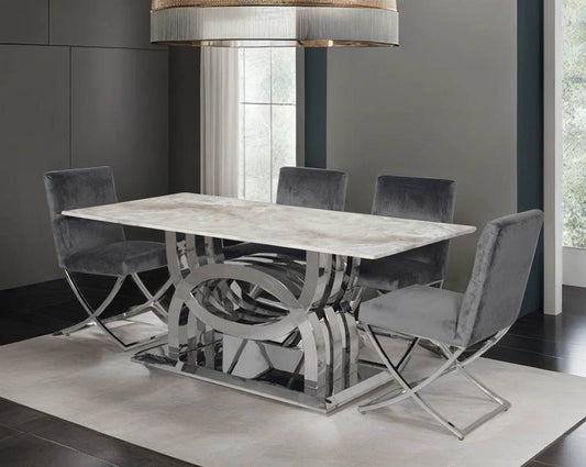 6 & 8 seater rectangular dining table with marble top comes with an artful stainless steel base. Dining chair upholstered in fabric with high polished stainless steel legs in a cross design.