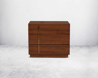 this eye-catching bedside  behind table, constructed from light walnut veneer with three drawers & gold-finished stainless steel handles.