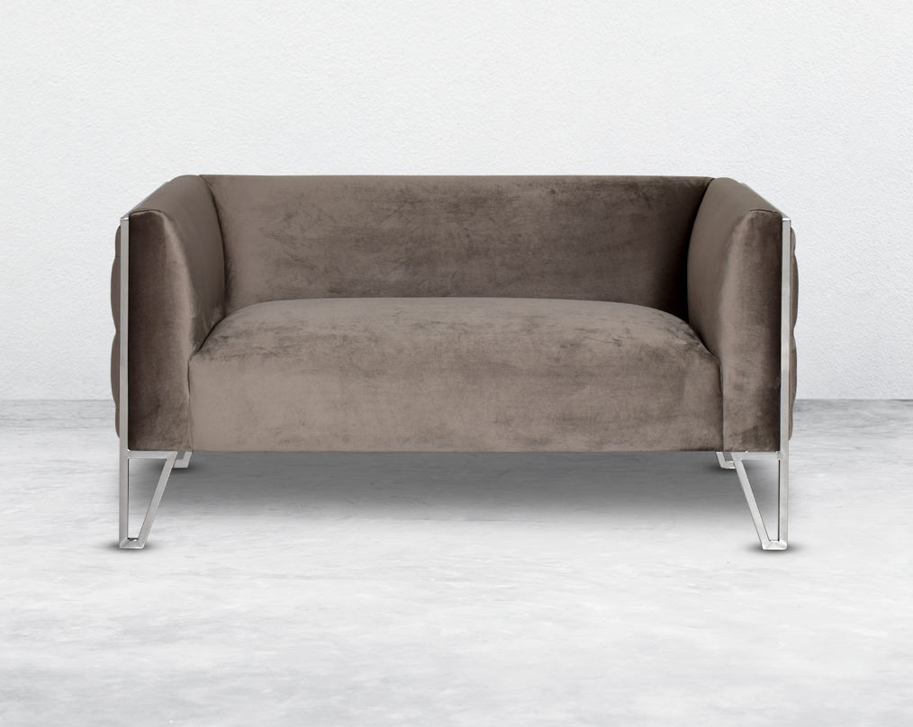 This 2  seater sofa set is the perfect addition to any living space looking to add a modern classic feel. Crafted beautifully with high polished stainless steel geometric legs and upholstered in luxurious velvet