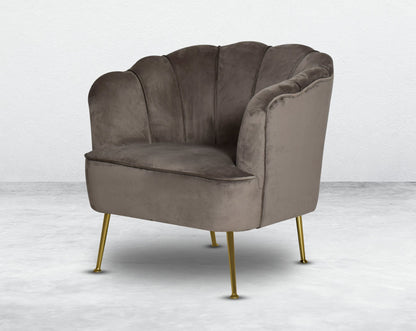 This 1 seater sofa set comes in a high-quality suede fabric with a quilted backrest that accentuates It has gold-plated stainless steel legs in modern classic design