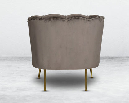 This 1 seater sofa set comes in a high-quality suede fabric back with a quilted backrest that accentuates It has gold-plated stainless steel legs in modern classic design