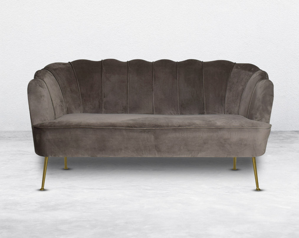 This 2 seater sofa set comes in a high-quality suede fabric with a quilted backrest that accentuates It has gold-plated stainless steel legs in modern classic design.