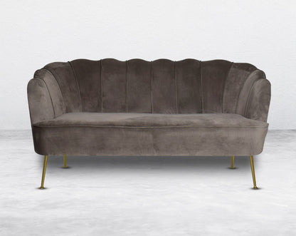 This 2 seater sofa set comes in a high-quality suede fabric with a quilted backrest that accentuates It has gold-plated stainless steel legs in modern classic design.