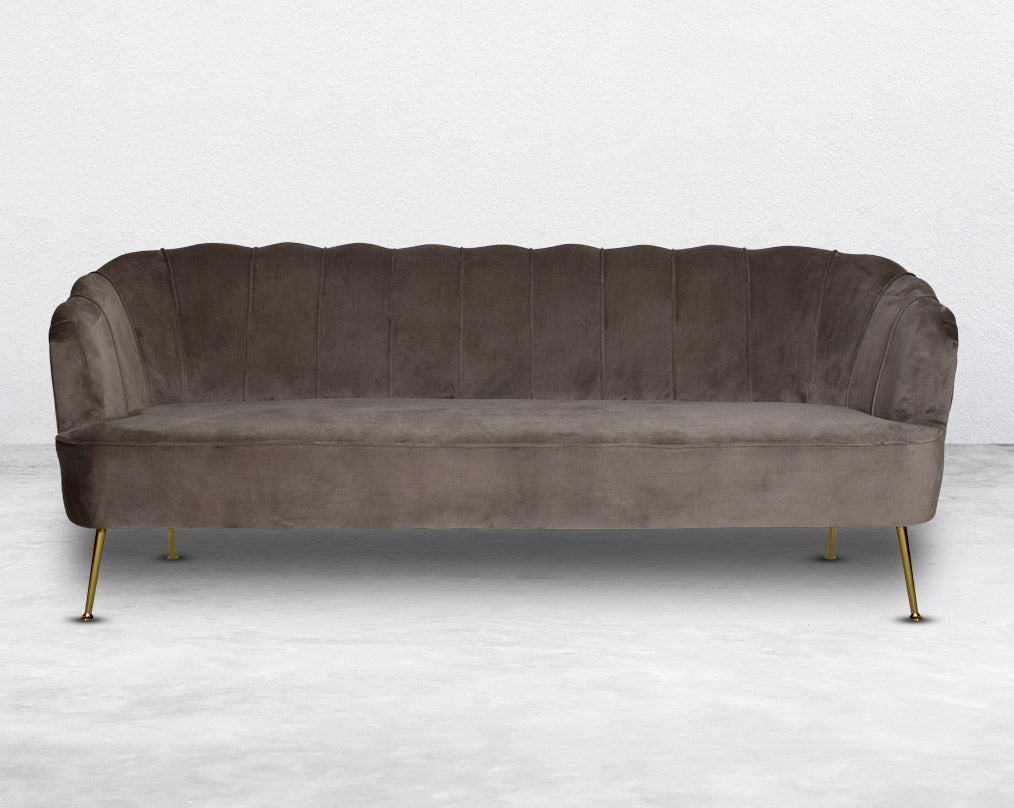 This 3 seater sofa set comes in a high-quality suede fabric with a quilted backrest that accentuates It has gold-plated stainless steel legs in modern classic design.