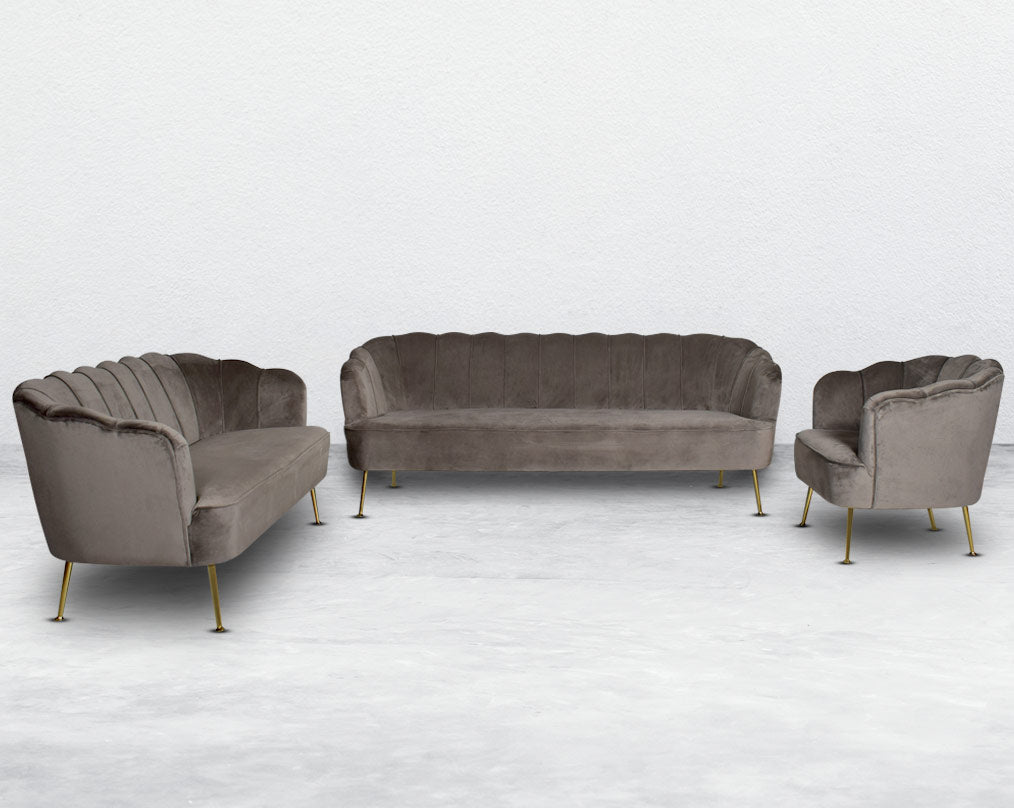 This 3+2+1 seater sofa set comes in a high-quality suede fabric with a quilted backrest that accentuates the simplicity inspired by the graceful blossom of a flower. It has gold-plated stainless steel legs in modern classic design.