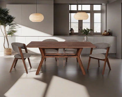 6 seater rectangular dining table in walnut. Dining chair in walnut with seat upholstered in fabric.