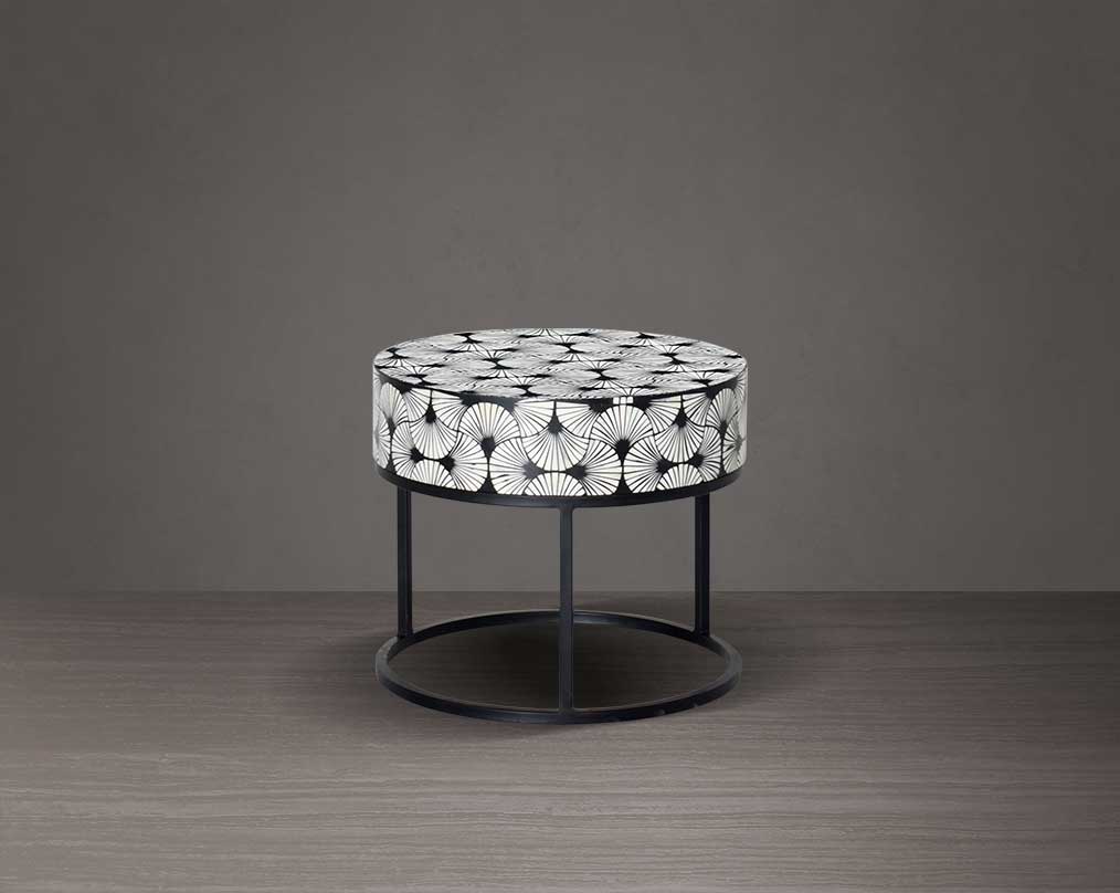 This gorgeous black and white inlay end table in floral pattern with a black metal base is a perfect statement piece in your living room.