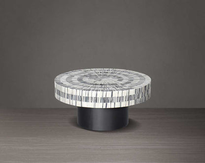 This gorgeous antique black and white inlay coffee table with a black metal base is a perfect statement piece in your living room - small