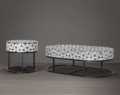 This gorgeous black and white inlay end table in floral pattern with a black metal base is a perfect statement piece in your living room.
