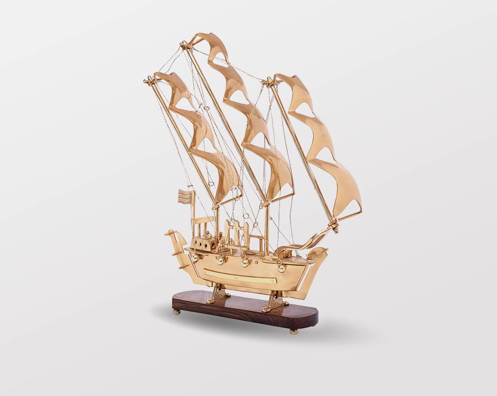 Decorative ship in antique gold and sheesham wood base. large