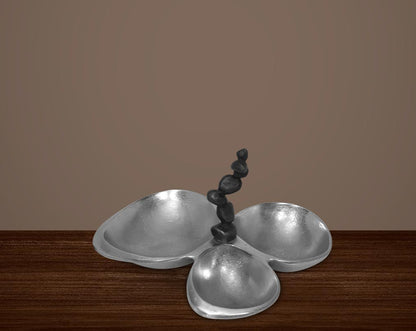 This attractive nickel finished aluminum tri bowl makes for a perfect serving for any occasion. It features three bowls to have condiments with a swirl handle design for easy handling.