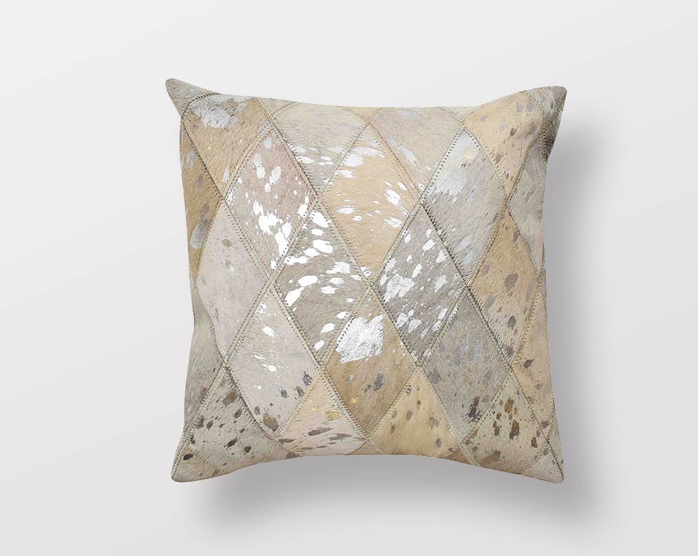 White and silver hair on a leather cushion.