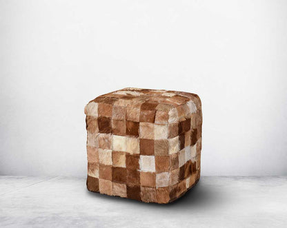 This square-shaped brown pouffe is crafted from wood and wrapped in genuine hair-on cutout leather in diff shades of brown which gives a rich contemporary look to any modern space.