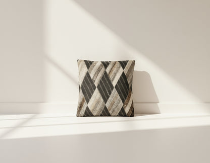 Black and grey hair on the leather cushion.