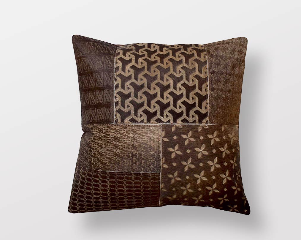 Brown hair on a leather cushion.