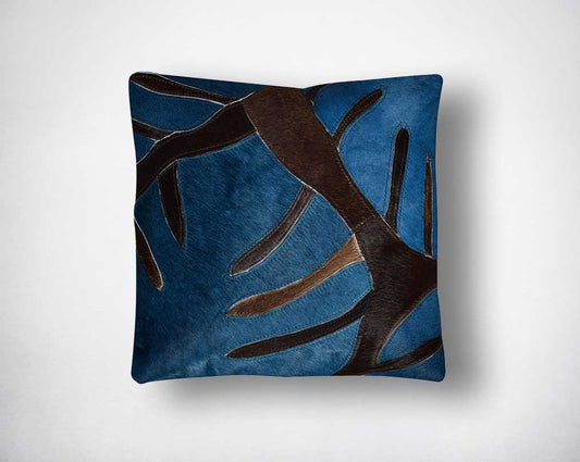 Navy blue and brown hair on a leather cushion.