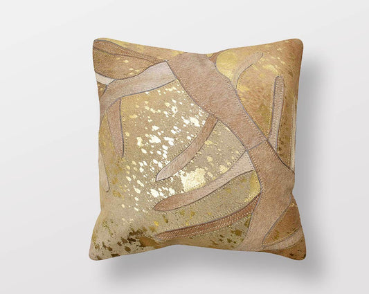 Gold and beige hair on a leather cushion.