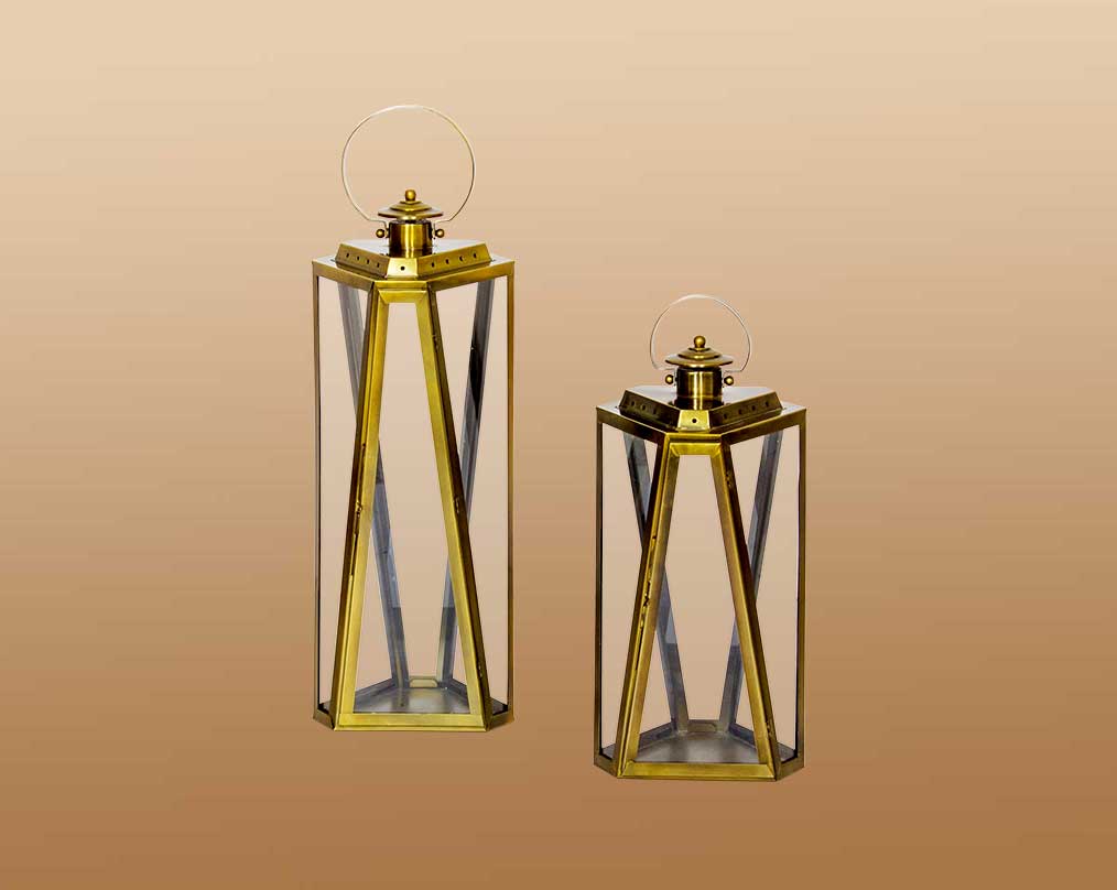 Lantern with clear glass and brass plated stainless steel.