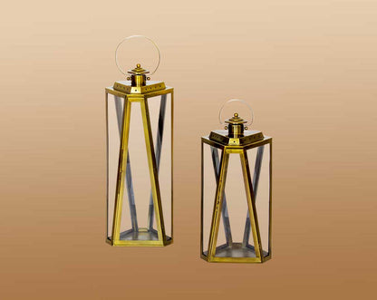 Lantern with clear glass and brass plated stainless steel.