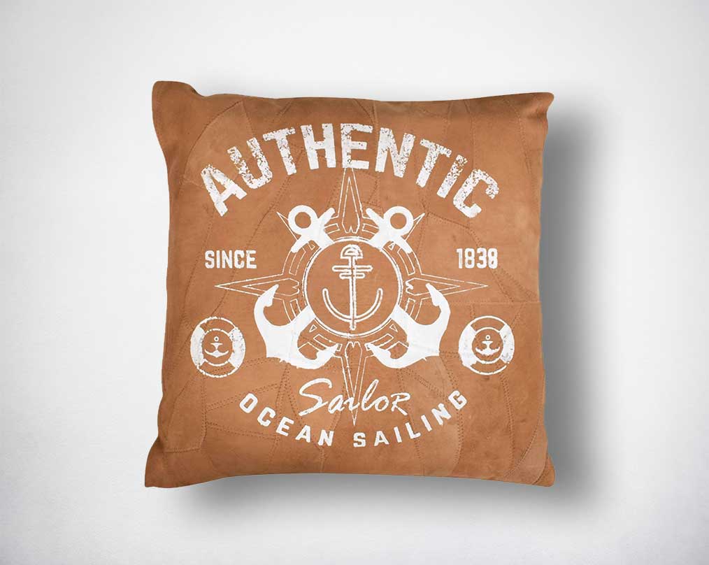 Leather cushion with white print.