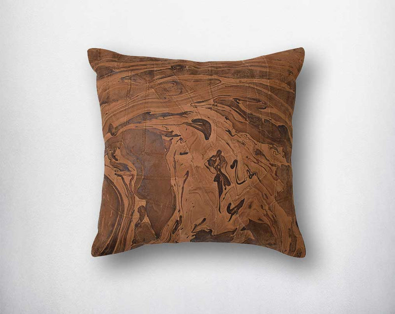 Tan leather cushion with marble design/foil.