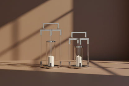 This lantern in modern contemporary style iscrafted in steel in shiny nickel finish with clear glass & an acrylic frame. This is a perfect mood setter enhancing any room with its glow. 1large 2 small